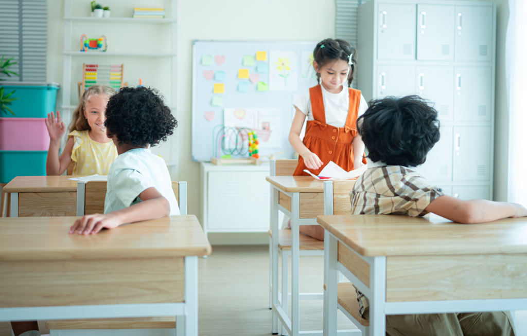Students learn and study in a classroom of school where youngsters sit and listen attentively.